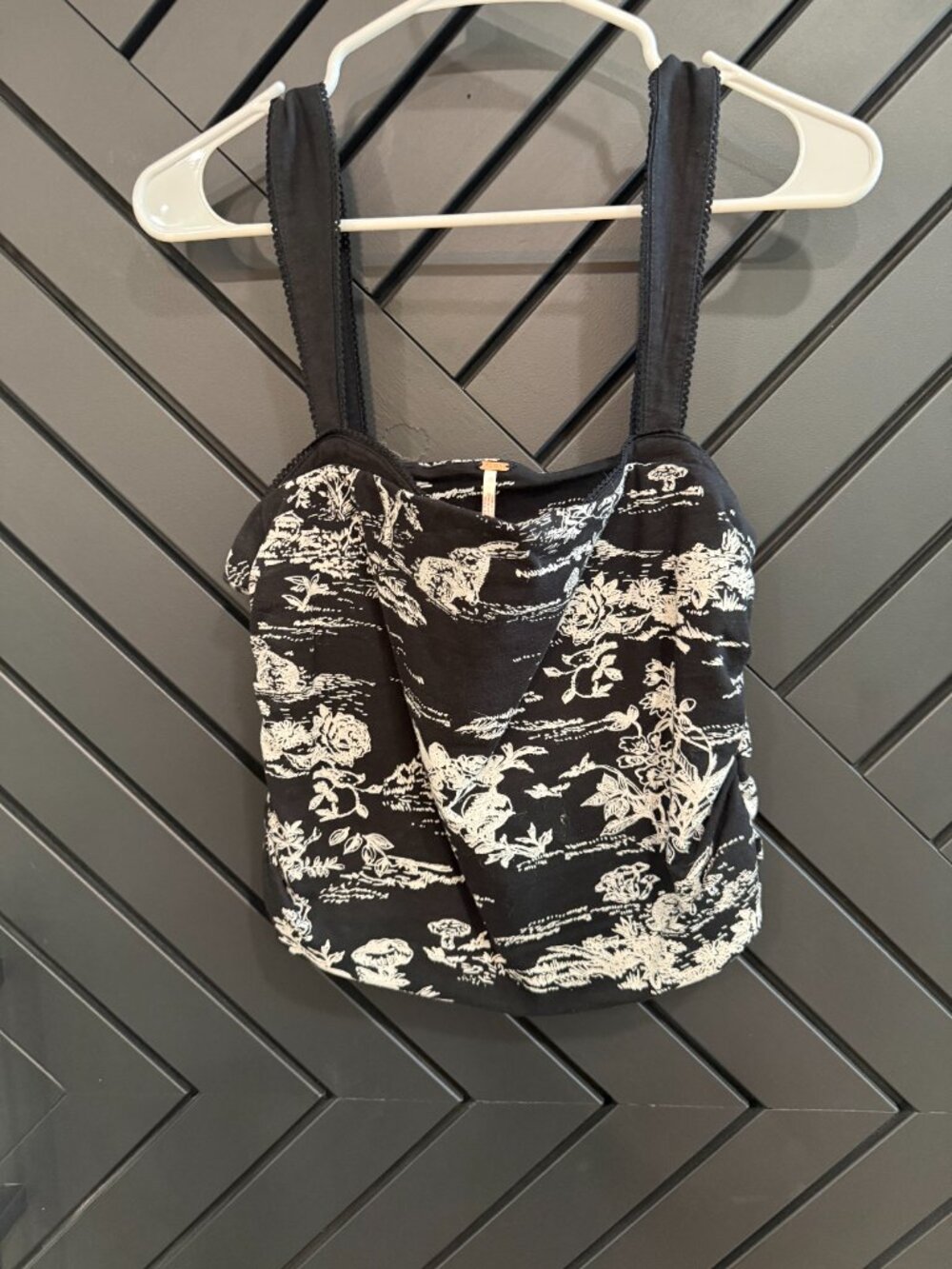 This Free People black and white toile print tank top features thick straps.